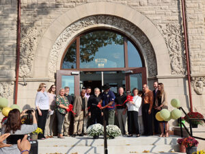 Board of Commissioners Jeremiah Jones cuts the ribbon at the 125th anniversary celebration