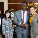 Zhangs Receive Ellis Island Medal